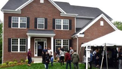 Prince George's County officials, teachers, volunteers and parents attend a May 9 ceremony to celebrate students who built a 3,900-square-foot house in Brandywine, Maryland, as part of public school system's Foundation for Applied Construction Technology for Students (FACTS) program. (Robert Roberts/The Washington Informer)