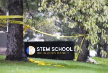 A small vigil sits next to the entrance to the STEM School Highlands Ranch in Highlands Ranch, Colorado, on on May 8, 2019, one day after two students entered the school with pistols, killing one student and injuring eight others. (Michael Ciaglo/Getty Images)